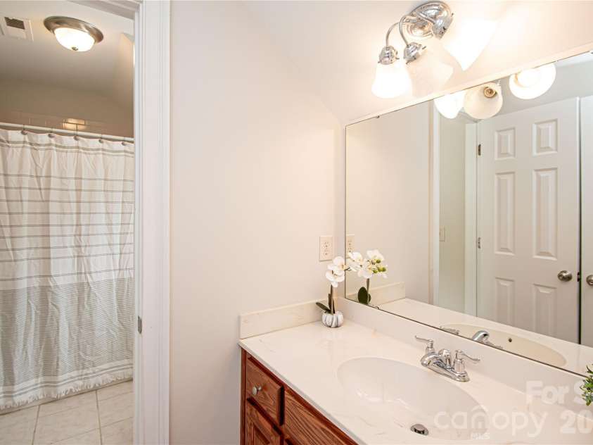 1015 Estate Lane, Matthews, NC 28104.  MLS# CAR4388127, YatesRealty ID 33333. Jack and Jill bathroom