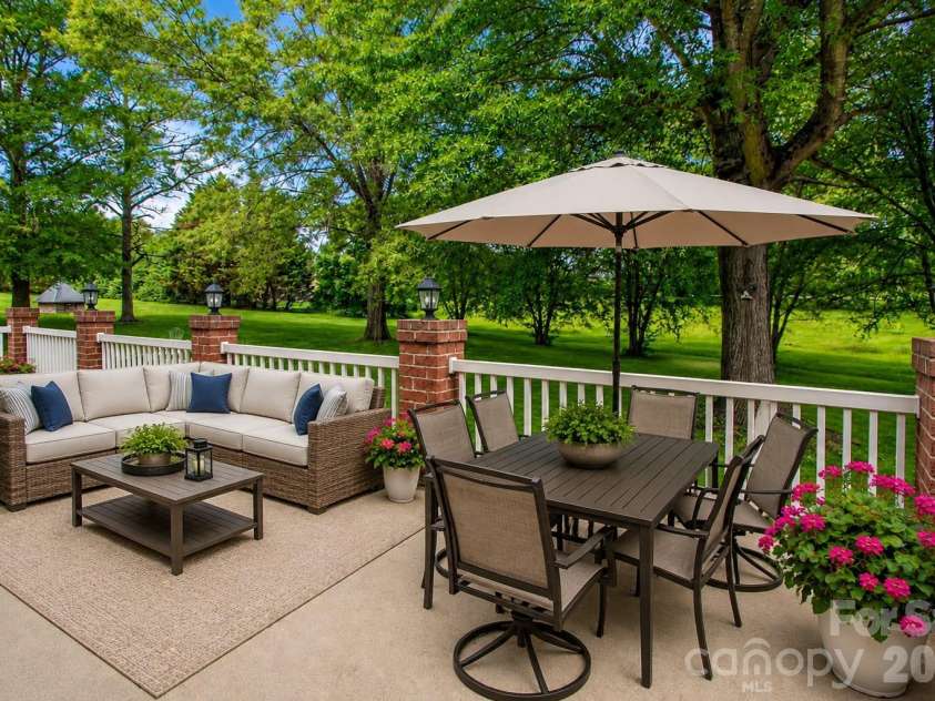 1015 Estate Lane, Matthews, NC 28104.  MLS# CAR4388127, YatesRealty ID 33333. Large back patio perfect for entertaining.