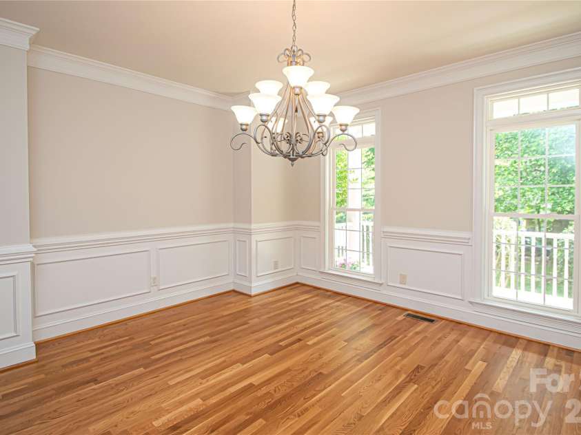 1015 Estate Lane, Matthews, NC 28104.  MLS# CAR4388127, YatesRealty ID 33333. Very spacious dinning room large enough for 10-12 chairs.