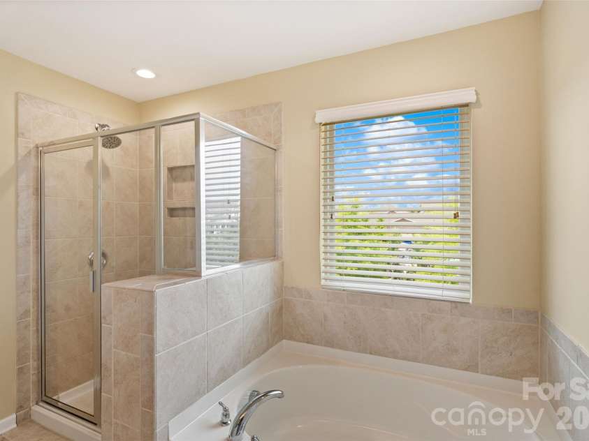1401 Kings Grove Drive, York, SC 29745.  MLS# CAR4391337, YatesRealty ID 33342. Tiled Shower and Soaking Tub