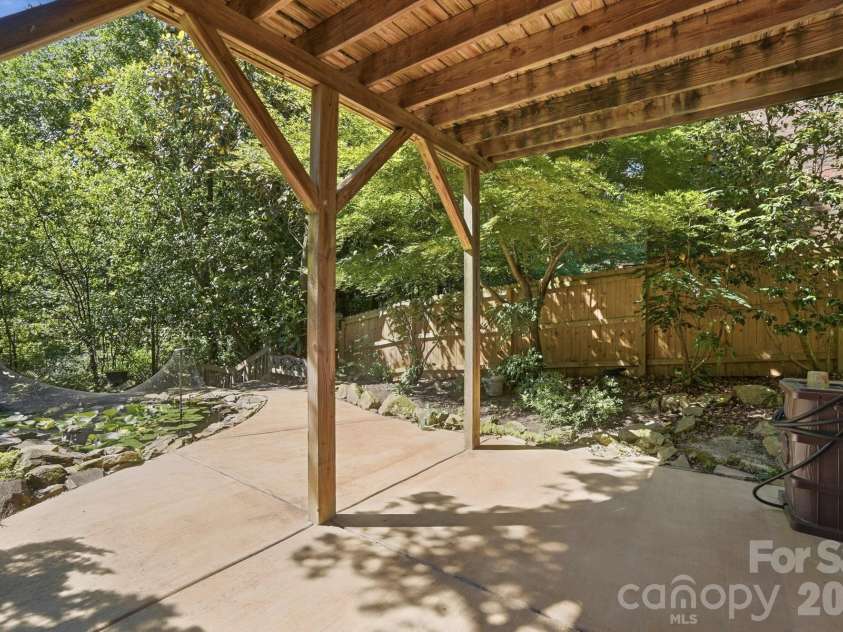 723 Walnut Point Drive, Matthews, NC 28105.  MLS# CAR4391716, YatesRealty ID 33345. Covered Patio Next to Pond