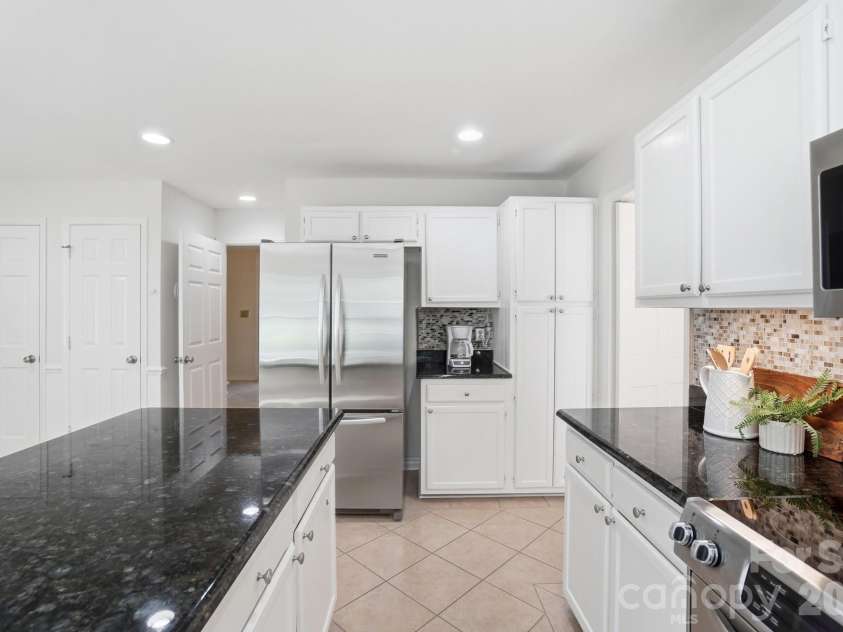723 Walnut Point Drive, Matthews, NC 28105.  MLS# CAR4391716, YatesRealty ID 33345. Kitchen w/Stainless Steel Refrigerator, Ample Cabinet Storage