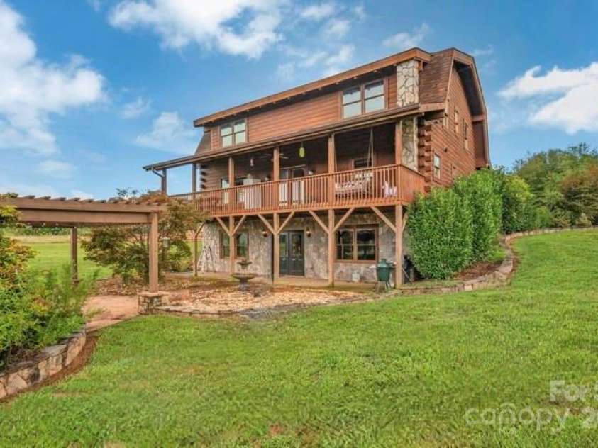 112 Gene Mcgaha Lane, Mooresboro, NC 28114.  MLS# CAR4276024, YatesRealty ID 33363. Back view of the house