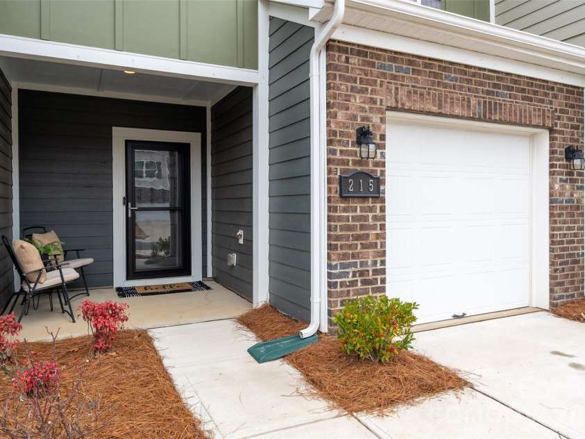 215 Harpers Run Lane, Matthews, NC 28104.  MLS# CAR4336514, YatesRealty ID 33366. Covered front porch