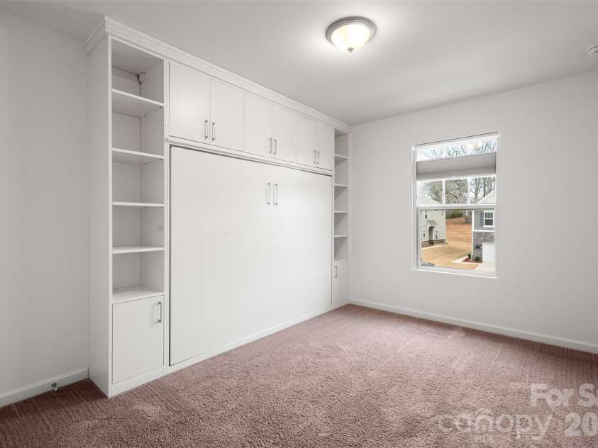 215 Harpers Run Lane, Matthews, NC 28104.  MLS# CAR4336514, YatesRealty ID 33366. Custom murphy bed for great space savings!