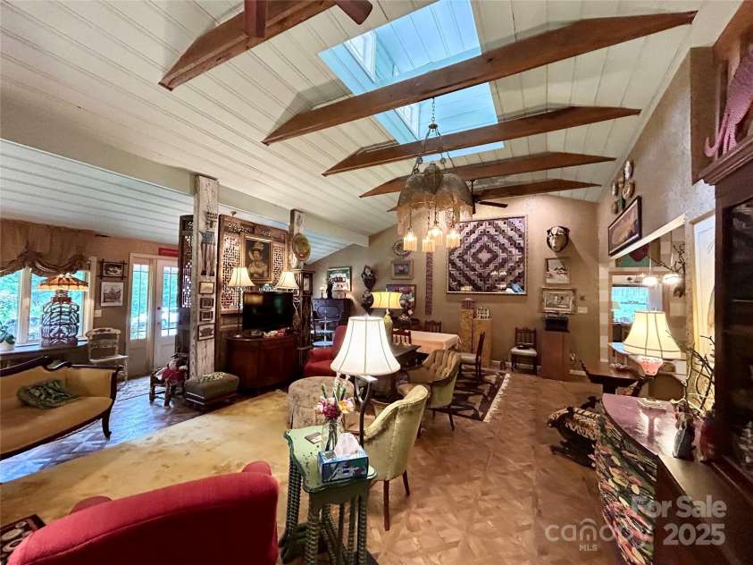 100 Ivy Hill Lane, Tryon, NC 28782.  MLS# CAR4273612, YatesRealty ID 33368. Living Room Clerestory windows