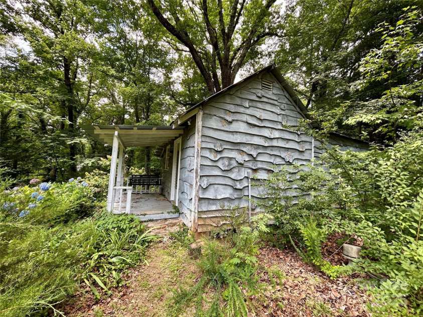100 Ivy Hill Lane, Tryon, NC 28782.  MLS# CAR4273612, YatesRealty ID 33368. Shed side