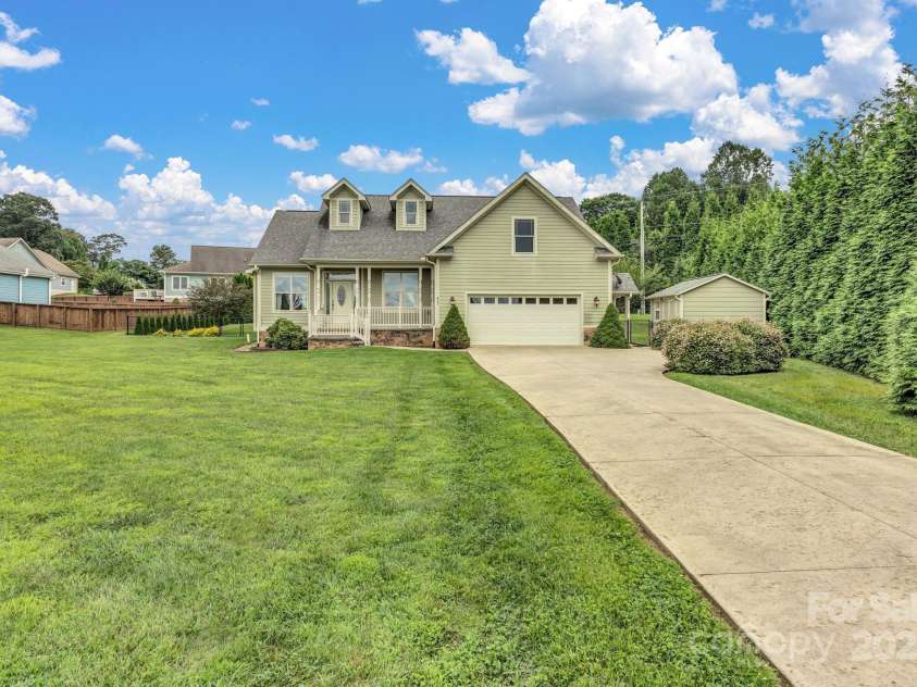 432 Oak Grove Road, Flat Rock, NC 28731.  MLS# CAR4286184, YatesRealty ID 33380. Beautiful home with amazing yard, nice garage and outbuilding
