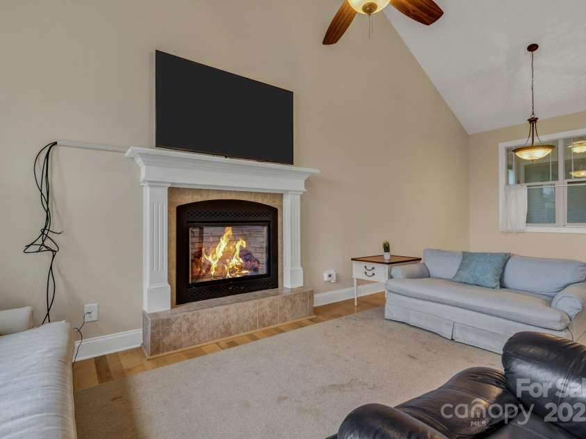 432 Oak Grove Road, Flat Rock, NC 28731.  MLS# CAR4286184, YatesRealty ID 33380. Living room w fireplace