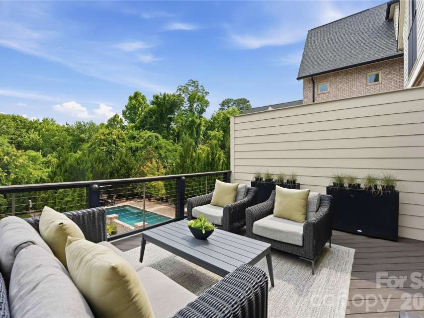 812 Ideal Way, Charlotte, NC 28203.  MLS# CAR4389056, YatesRealty ID 33380. Upper patio accessed from the living room.