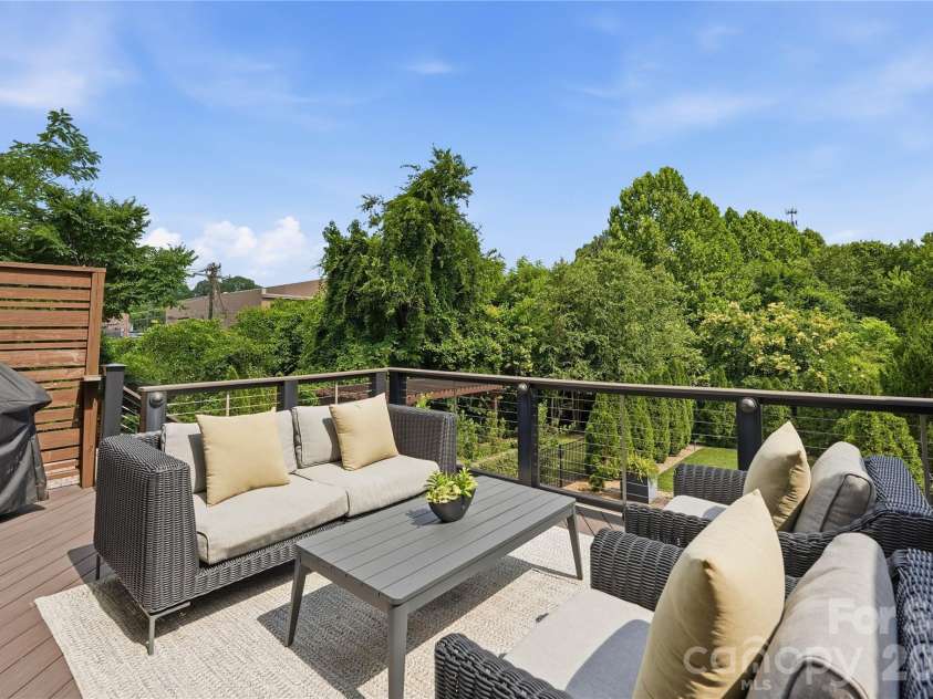 812 Ideal Way, Charlotte, NC 28203.  MLS# CAR4389056, YatesRealty ID 33380. Upper patio accessed from the living room.