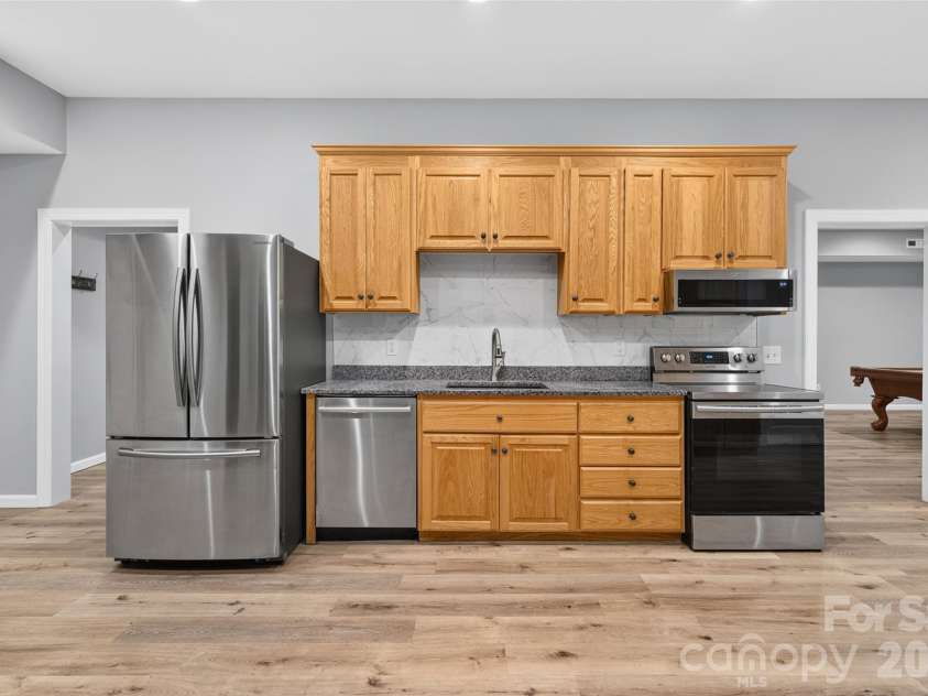 157 Natures Trail, Statesville, NC 28625.  MLS# CAR4396943, YatesRealty ID 33394. Basement kitchen