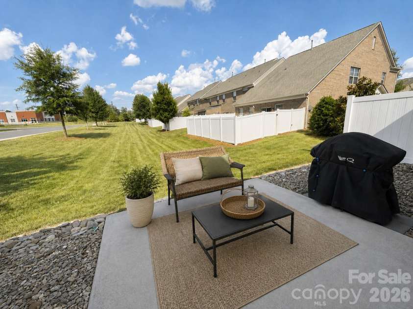 8012 Lantern Way, Fort Mill, SC 29707.  MLS# CAR4393030, YatesRealty ID 33401. Back patio with no one directly behind*virtual staging added