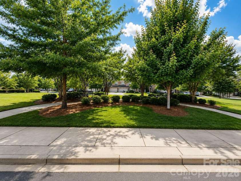 8012 Lantern Way, Fort Mill, SC 29707.  MLS# CAR4393030, YatesRealty ID 33401. Common Green Space directly in front of unit.
