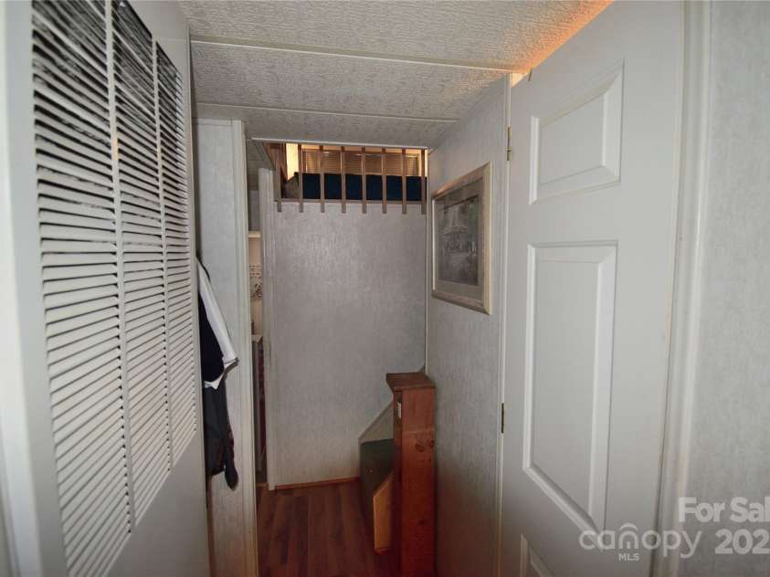 101 Hummingbird Circle, New London, NC 28127.  MLS# CAR4293421, YatesRealty ID 33406. Hallway to bedrooms, bathrooms and stairs