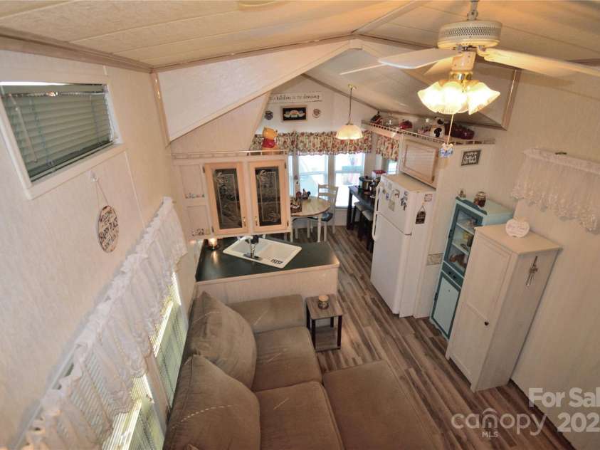 101 Hummingbird Circle, New London, NC 28127.  MLS# CAR4293421, YatesRealty ID 33406. Overlooking living area from the loft