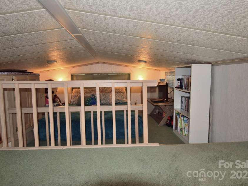 101 Hummingbird Circle, New London, NC 28127.  MLS# CAR4293421, YatesRealty ID 33406. Upstairs loft facing the back end of the home loft area