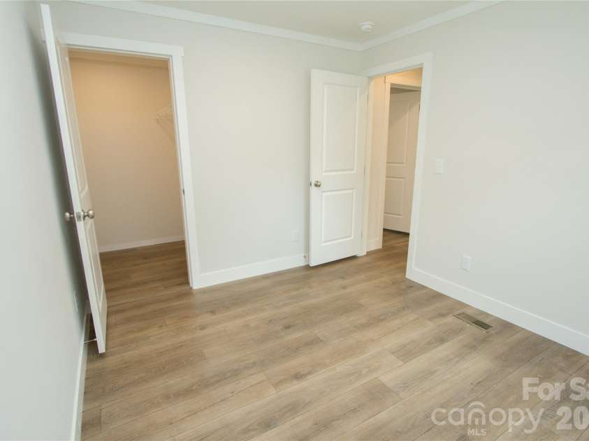 30 Babb Street, Waynesville, NC 28786.  MLS# CAR4280509, YatesRealty ID 3341. Bedroom 3 w/ Walk-in closet