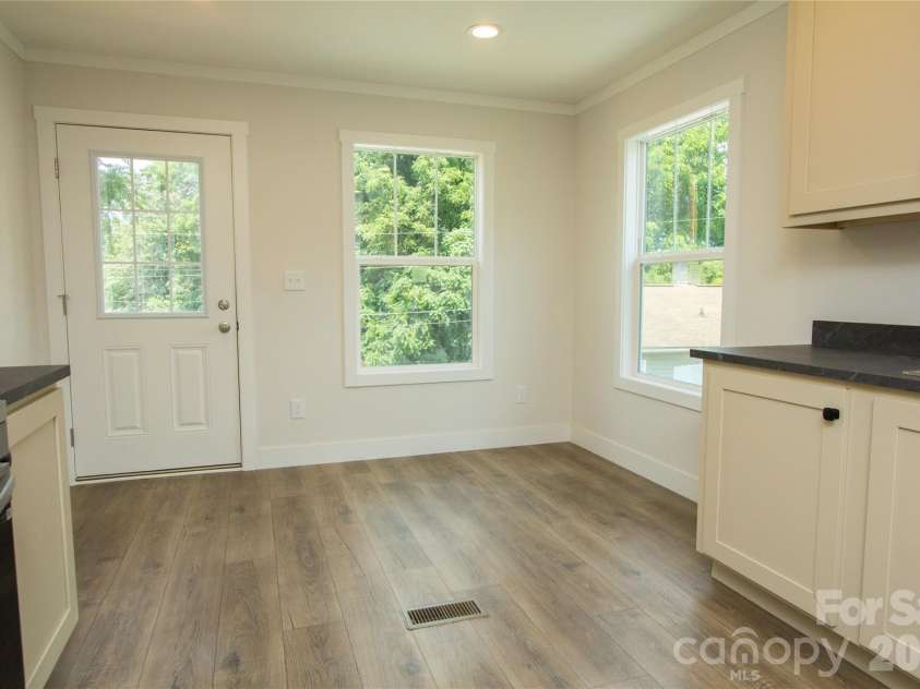 30 Babb Street, Waynesville, NC 28786.  MLS# CAR4280509, YatesRealty ID 3341. Kitchen w/ dining area