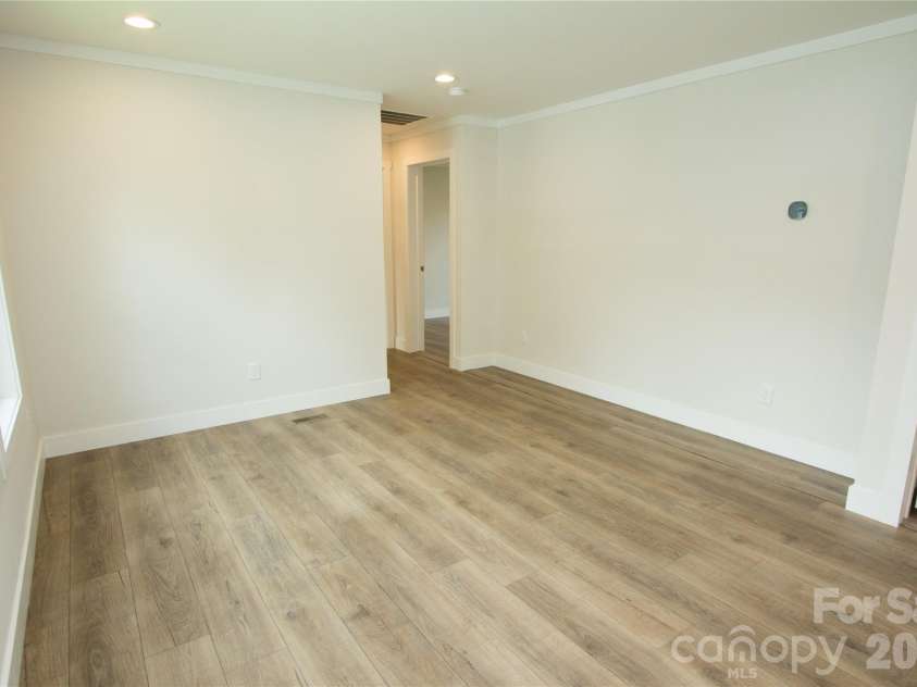 30 Babb Street, Waynesville, NC 28786.  MLS# CAR4280509, YatesRealty ID 3341. Living Room towards bedrooms