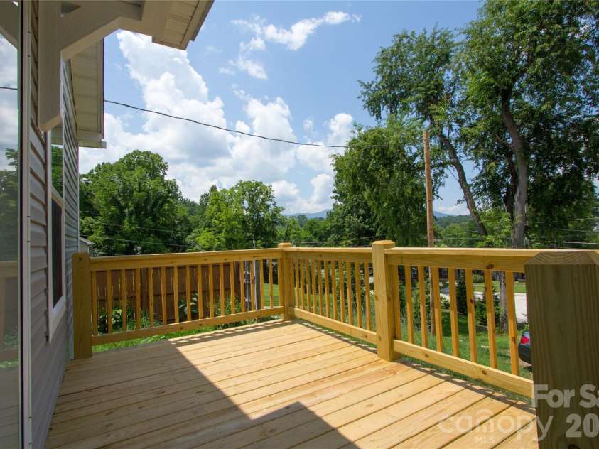 30 Babb Street, Waynesville, NC 28786.  MLS# CAR4280509, YatesRealty ID 3341. Sunny front deck off Kitchen & Dining area