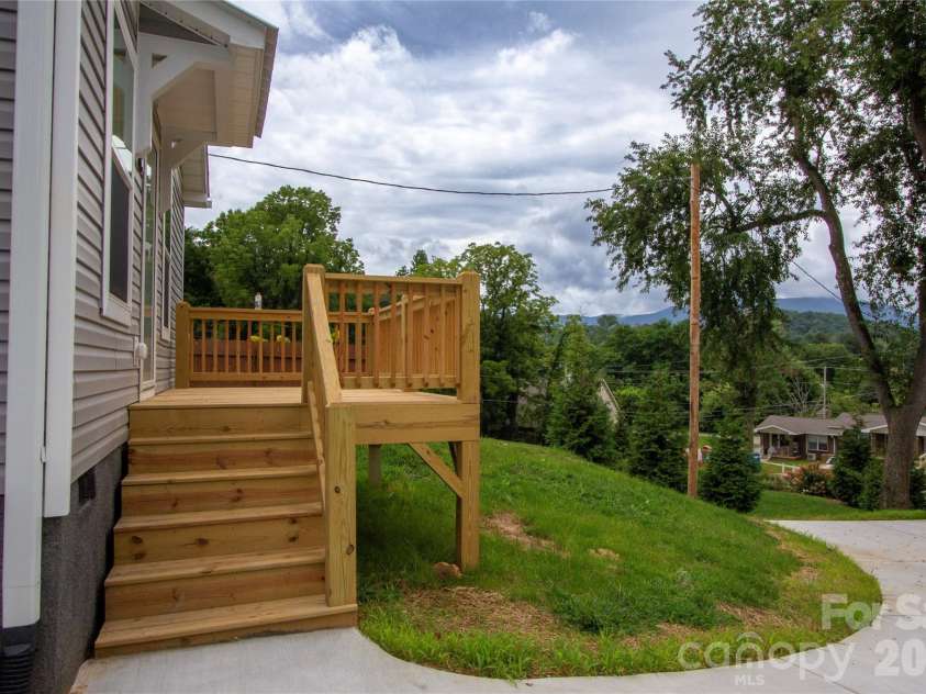 30 Babb Street, Waynesville, NC 28786.  MLS# CAR4280509, YatesRealty ID 3341. West facing Front Porch for sunset views