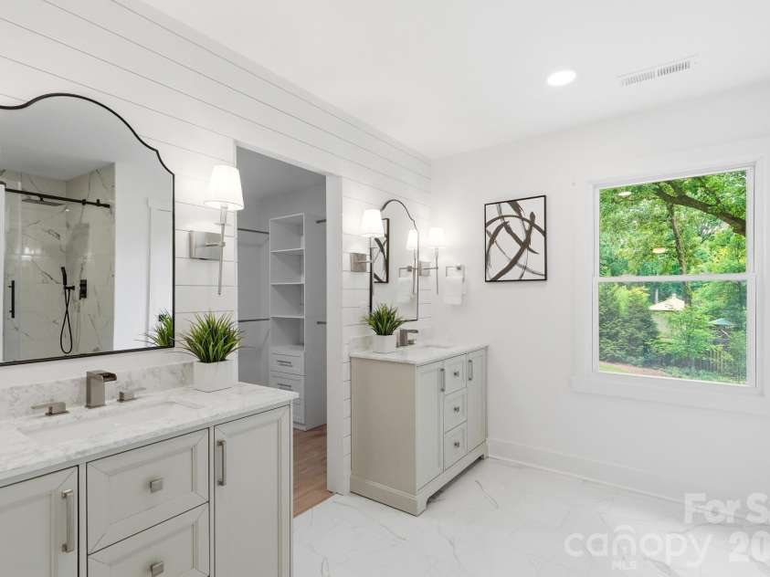 3800 Lovett Circle, Charlotte, NC 28210.  MLS# CAR4389040, YatesRealty ID 33413. Dual vanities with marble countertops, Custom shiplapped concealed walk-in closet door with custom closet system