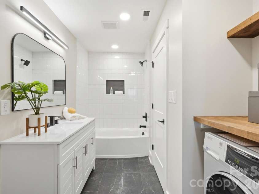 3800 Lovett Circle, Charlotte, NC 28210.  MLS# CAR4389040, YatesRealty ID 33413. Full bathroom with access from the hallway or Bed 5, Custom tilework &All-In-One Washer Dryer Combo 