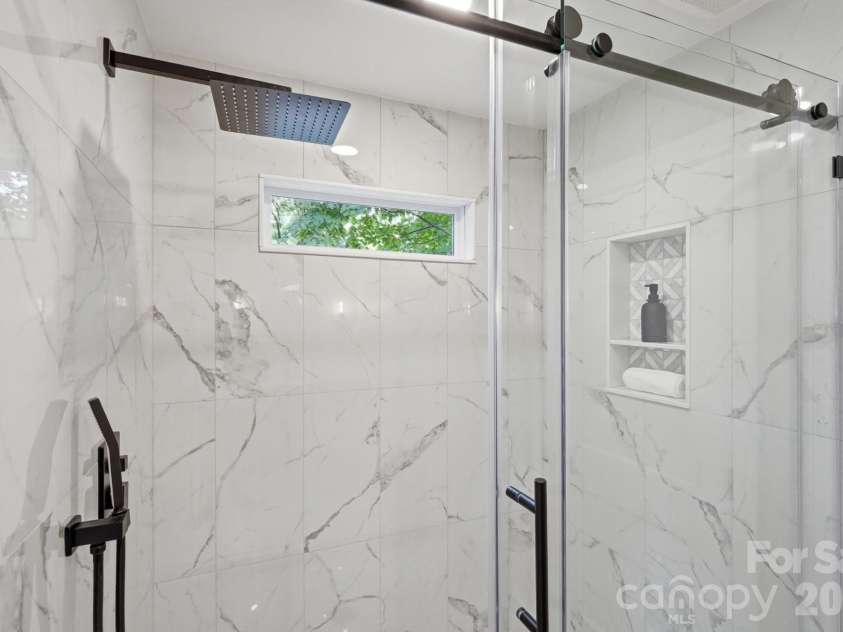 3800 Lovett Circle, Charlotte, NC 28210.  MLS# CAR4389040, YatesRealty ID 33413. Walk in Shower with Satori Venatino Parquet Polished Natural Marble Chevron Mosaic -Rainfall shower head with handwand, Transome window