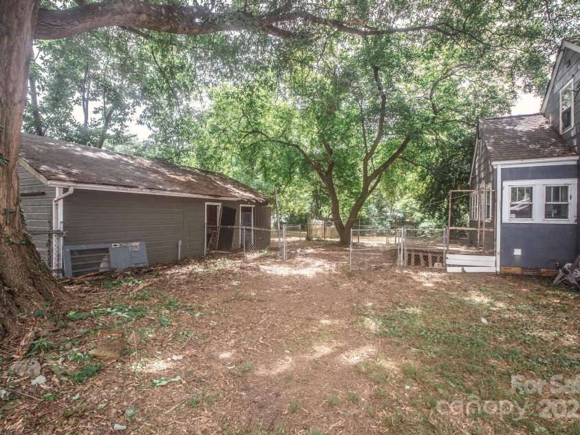 411 Jackson Street, Albemarle, NC 28001.  MLS# CAR4291947, YatesRealty ID 33421. Back of house/shed