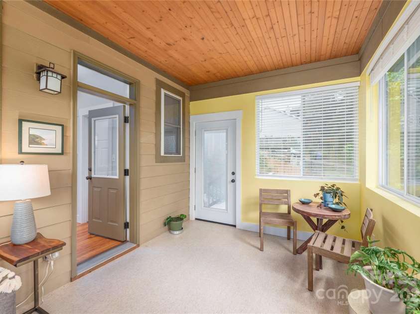 36 Richie Street, Asheville, NC 28801.  MLS# CAR4289429, YatesRealty ID 33422. Sunroom off kitchen