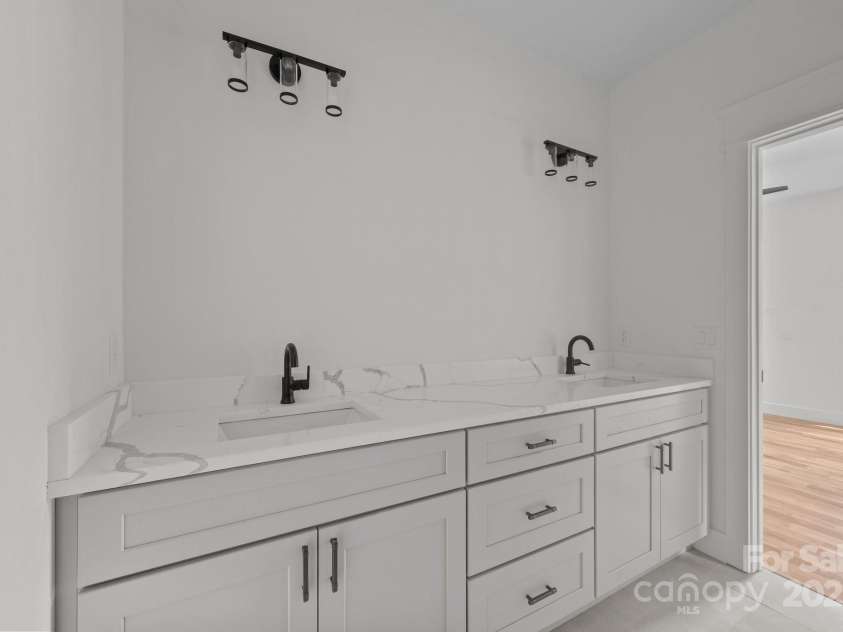 58 Pinedale Road, Asheville, NC 28805.  MLS# CAR4320485, YatesRealty ID 33430. Primary bath with double vanities