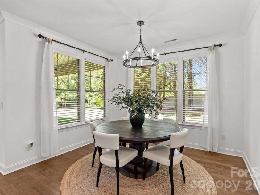 547 Muirfield Way, Salisbury, NC 28144.  MLS# CAR4385547, YatesRealty ID 33431. From the kitchen looking toward the dining area, covered patio and serene backyard.