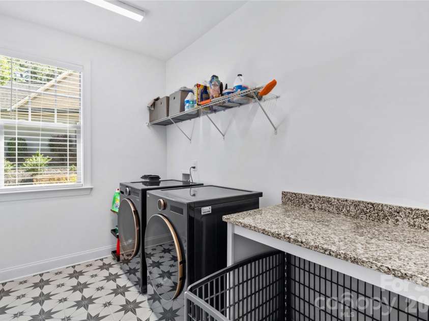 547 Muirfield Way, Salisbury, NC 28144.  MLS# CAR4385547, YatesRealty ID 33431. Laundry room with natural light and granite topped folding table.