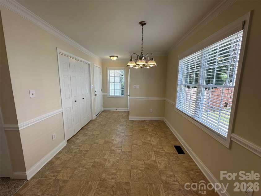 165 Bishop Lane, Concord, NC 28025.  MLS# CAR4395082, YatesRealty ID 33432. Breakfast area with Chair-rail & Crown Moldings
