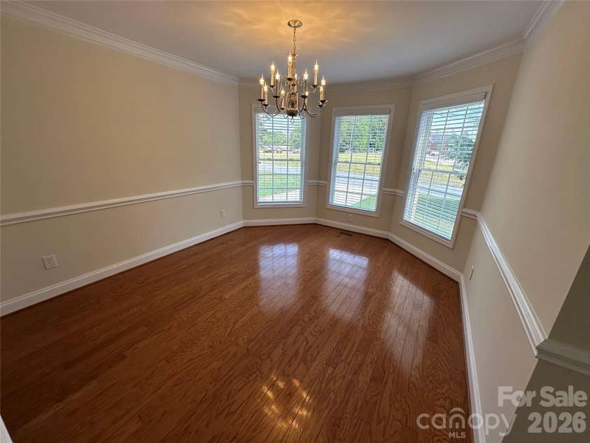 165 Bishop Lane, Concord, NC 28025.  MLS# CAR4395082, YatesRealty ID 33432. Formal Dining Rm with Wood Floors