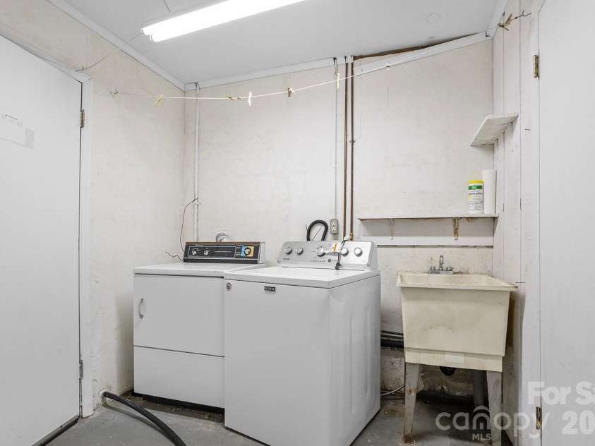 376 Stoney Brook Road, Penrose, NC 28766.  MLS# CAR4397828, YatesRealty ID 33434. Basement laundry area
