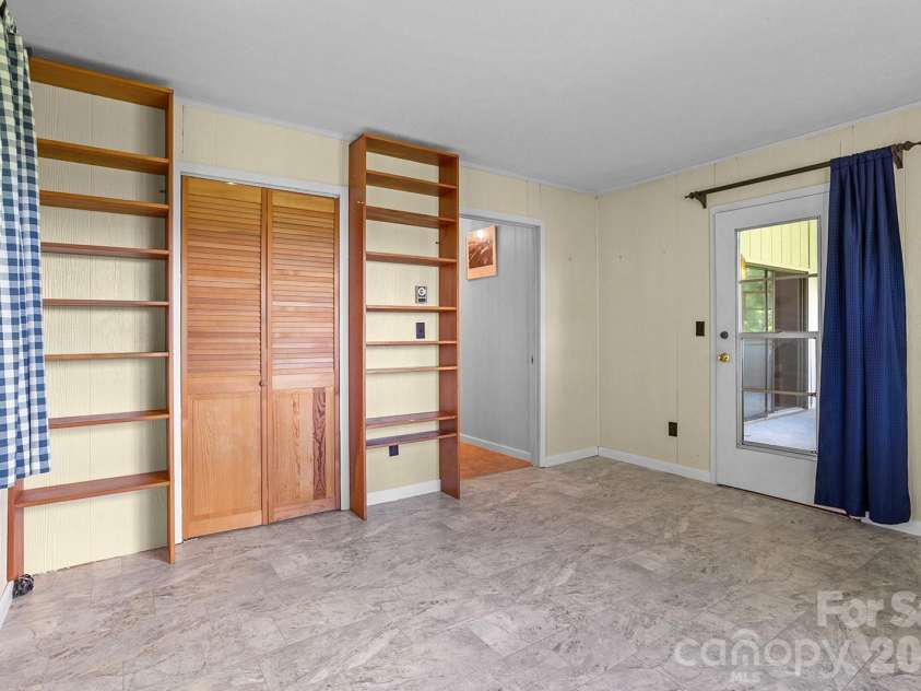 376 Stoney Brook Road, Penrose, NC 28766.  MLS# CAR4397828, YatesRealty ID 33434. Main level bedroom 1
