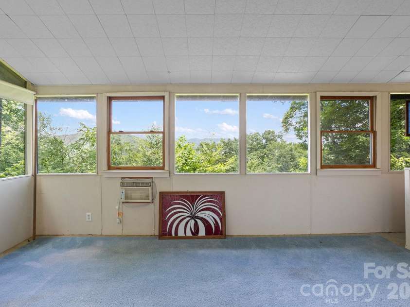 376 Stoney Brook Road, Penrose, NC 28766.  MLS# CAR4397828, YatesRealty ID 33434. Sunroom with expansive mountain views
