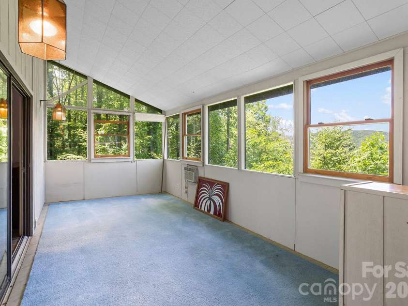 376 Stoney Brook Road, Penrose, NC 28766.  MLS# CAR4397828, YatesRealty ID 33434. Sunroom with long-range views