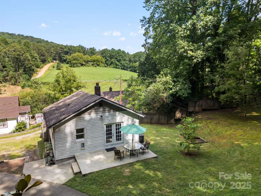 245 Hookers Gap Road, Candler, NC 28715.  MLS# CAR4290255, YatesRealty ID 33439. Rear of home with large patio; great for entertaining
