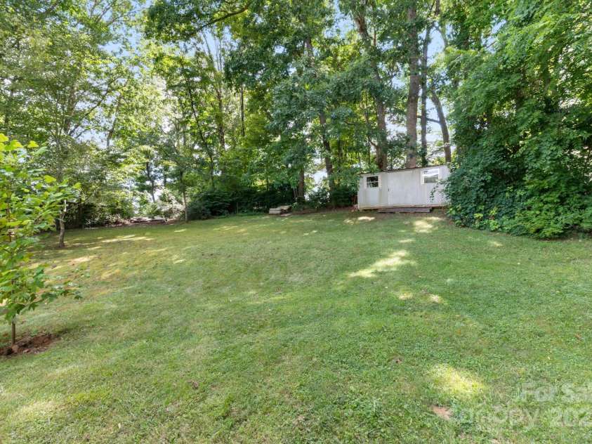 245 Hookers Gap Road, Candler, NC 28715.  MLS# CAR4290255, YatesRealty ID 33439. Storage shed in backyard
