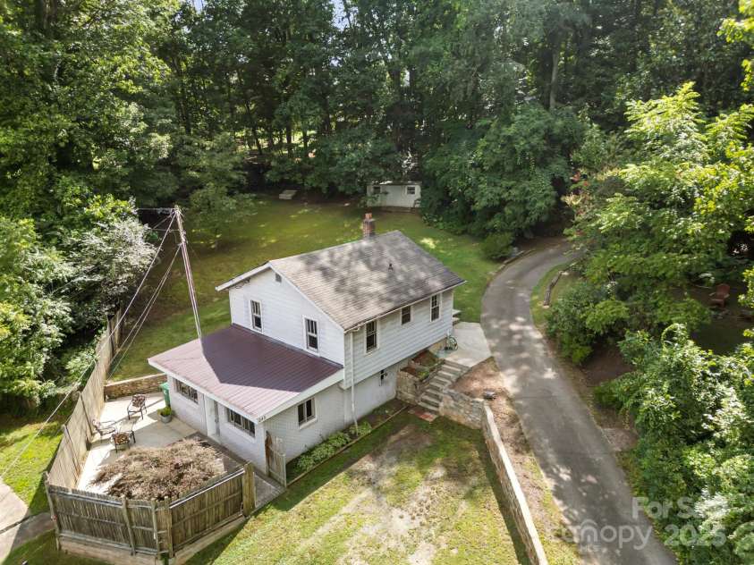 245 Hookers Gap Road, Candler, NC 28715.  MLS# CAR4290255, YatesRealty ID 33439. Wonderful outdoor spaces surround this cute home