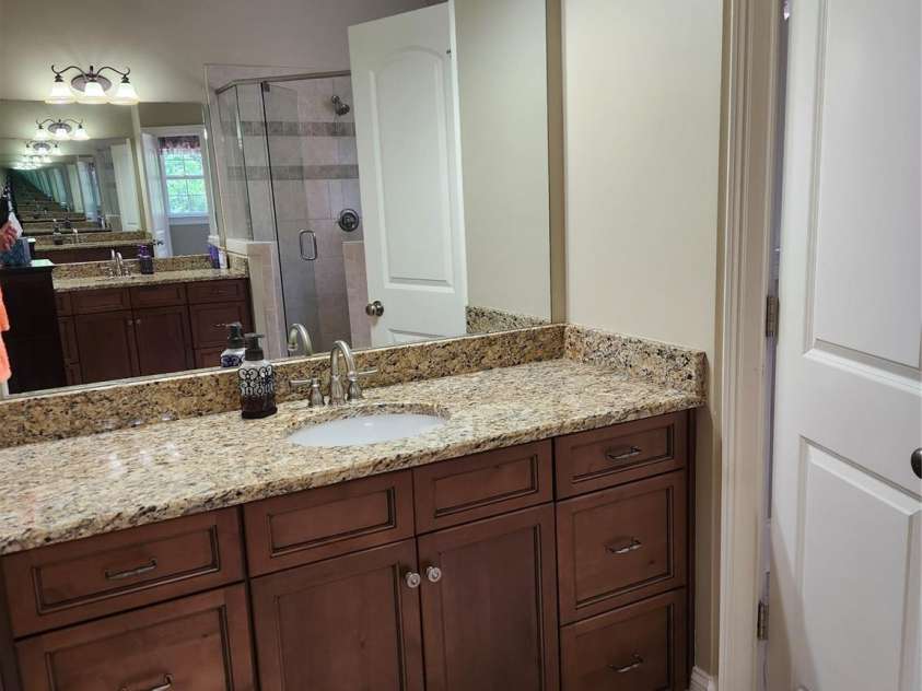 146 Orchard Farm Lane, Mooresville, NC 28117.  MLS# CAR4284274, YatesRealty ID 33442. One of two sinks in master bath