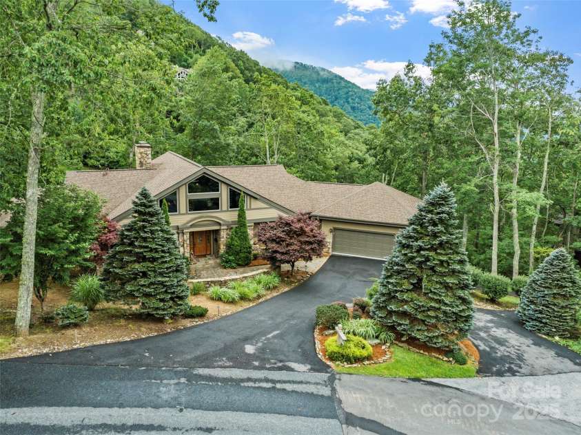 151 Austin Mountain Drive, Burnsville, NC 28714.  MLS# CAR4289442, YatesRealty ID 33443. Beautifully  landscaped with long-range mountain views