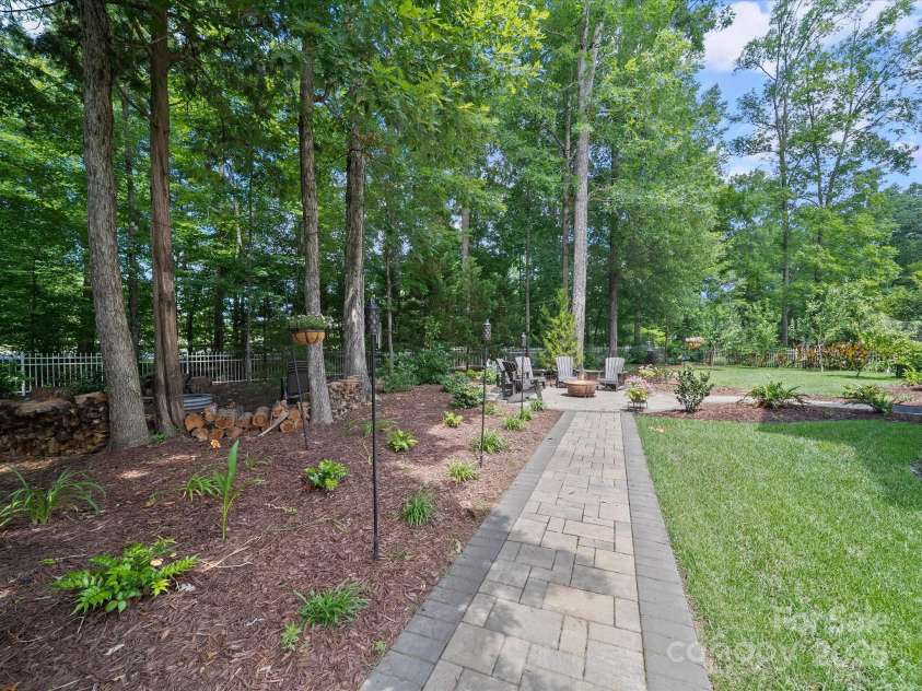1808 Mill Chase Lane, Waxhaw, NC 28173.  MLS# CAR4273047, YatesRealty ID 33450. Walk around back to this beautiful backyard