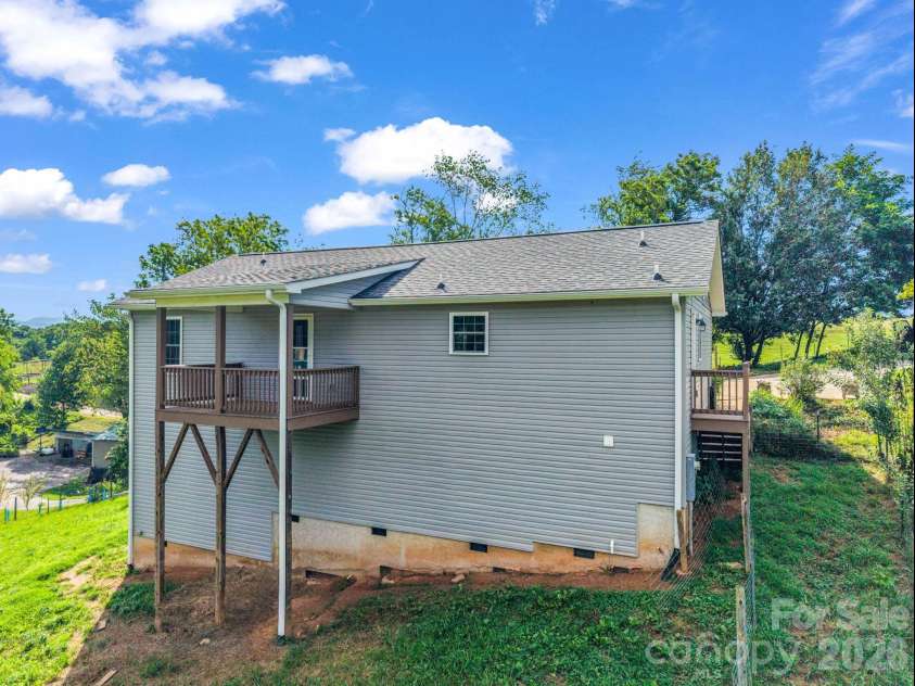 18 Old Chapman Place, Leicester, NC 28748.  MLS# CAR4398287, YatesRealty ID 33451. Back view of home