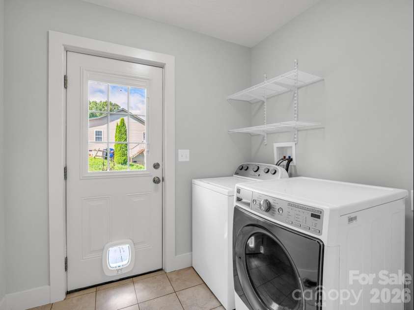 18 Old Chapman Place, Leicester, NC 28748.  MLS# CAR4398287, YatesRealty ID 33451. Laundry room off of kitchen