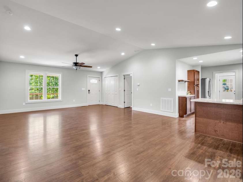 18 Old Chapman Place, Leicester, NC 28748.  MLS# CAR4398287, YatesRealty ID 33451. Living room & dining area