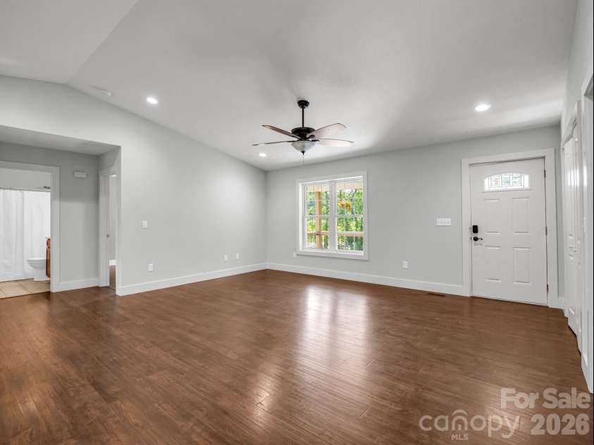 18 Old Chapman Place, Leicester, NC 28748.  MLS# CAR4398287, YatesRealty ID 33451. Living room & dining area